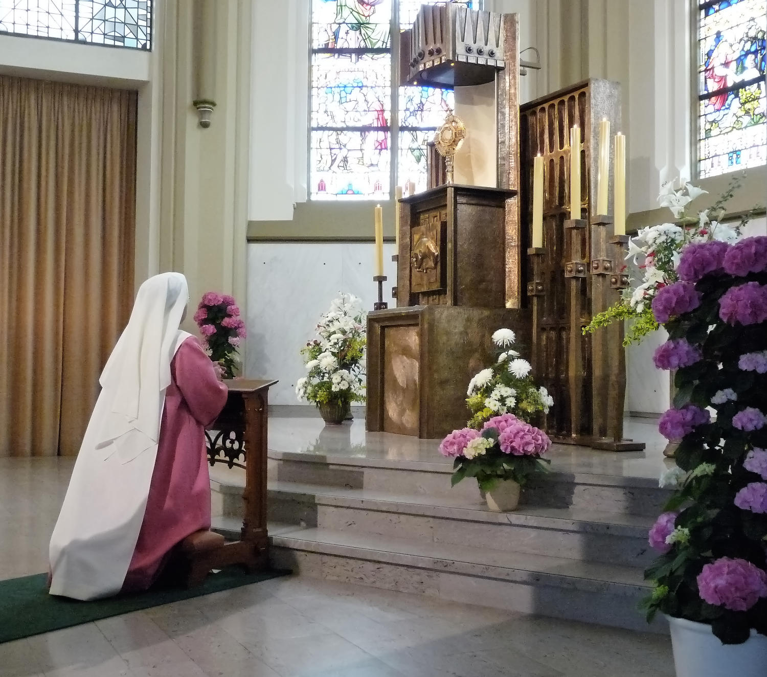 Sister of Perpetual Adoration before Jesus in the Eucharist