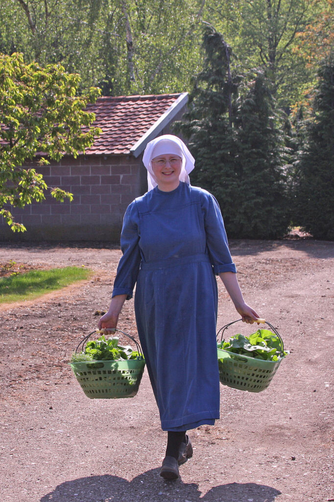 SSpS Sister in Steyil Carrying Baskets of Vegetables