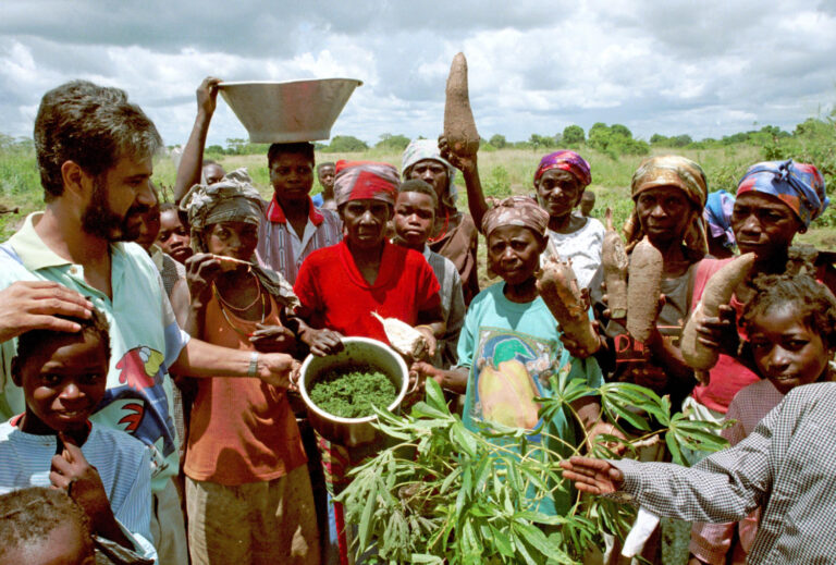 Community Member in Angola Showing the Harvest Products