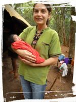 SSpS carries in her arms a little Baby of the Ava Guarani at the Indigenous Community in Paraguay
